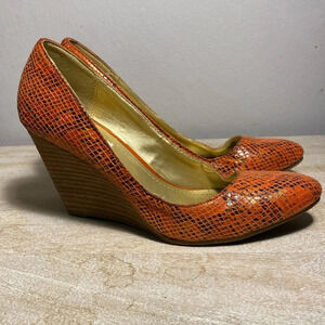 Kenneth Cole Reaction faux orange snakeskin size 8 wedge. “Side Street” line